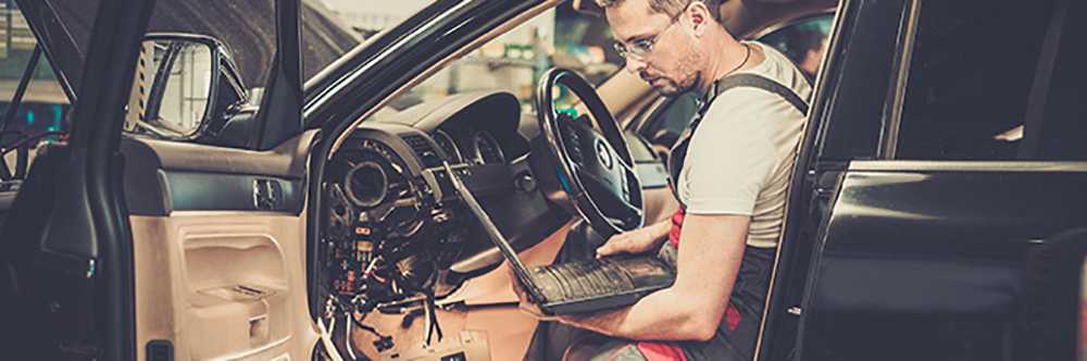 Technician undertaking Car MOT Testing